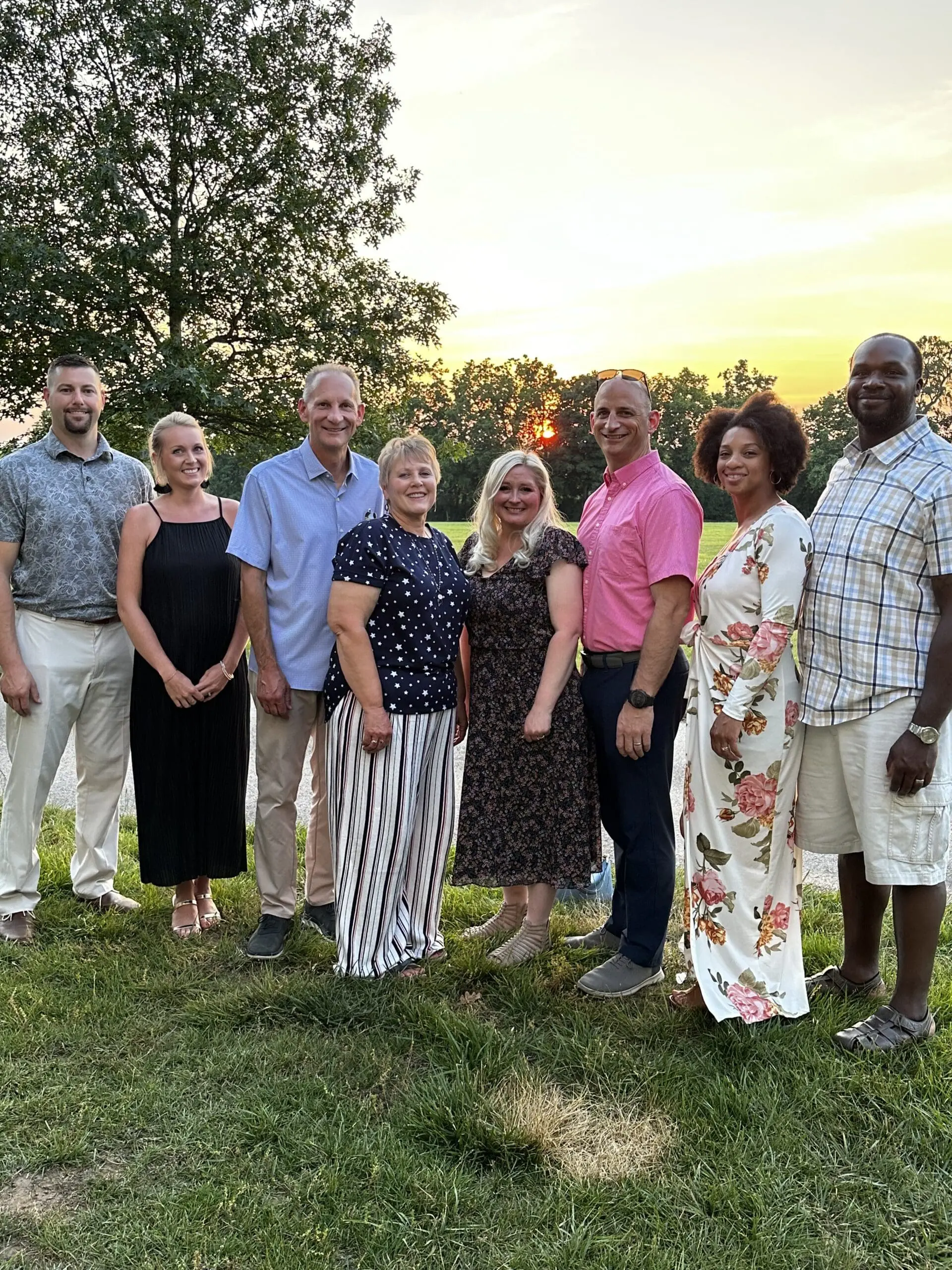 Messer Construction Company employees posing outside at sunset