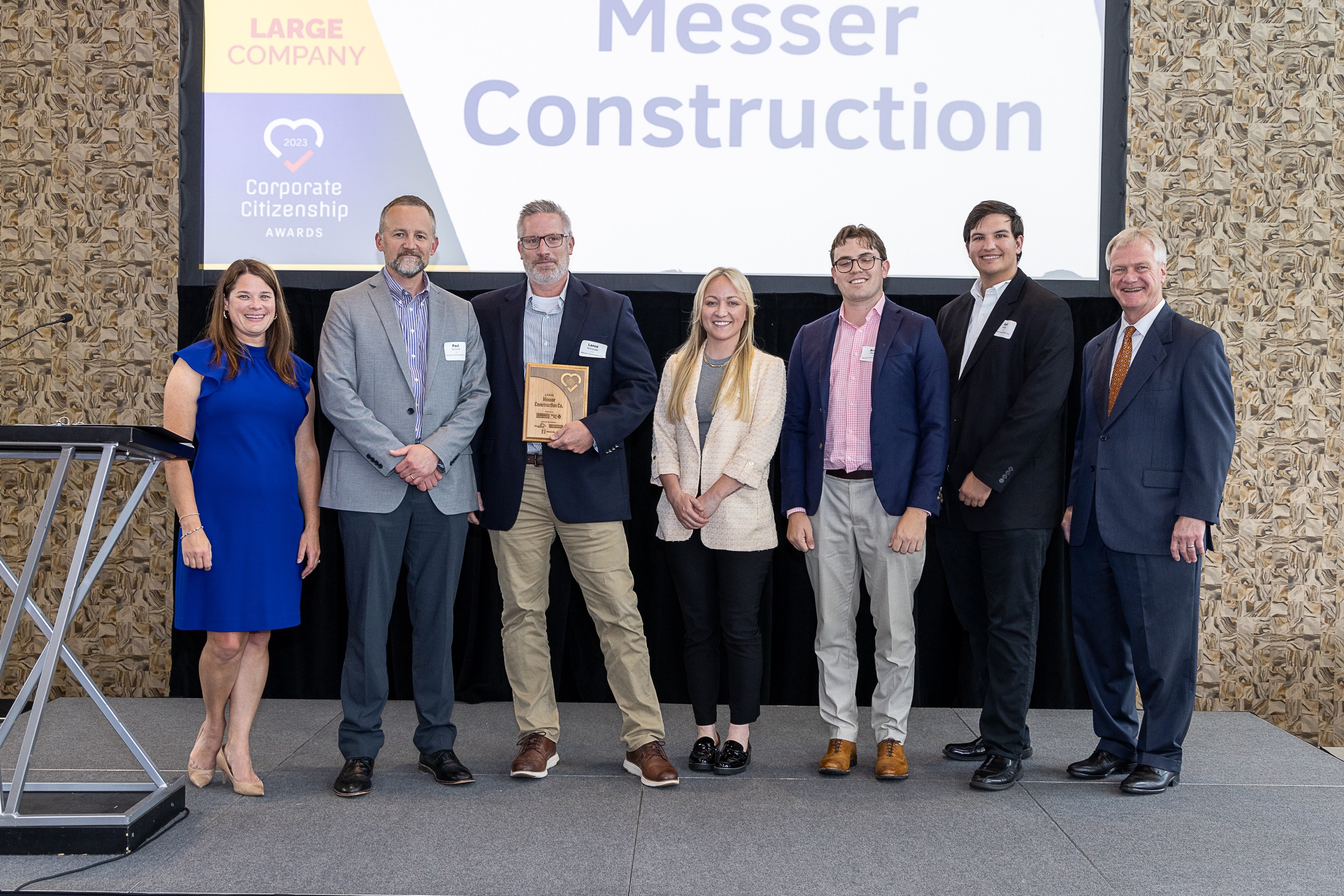 Messer Construction Company employees on stage accepting an award
