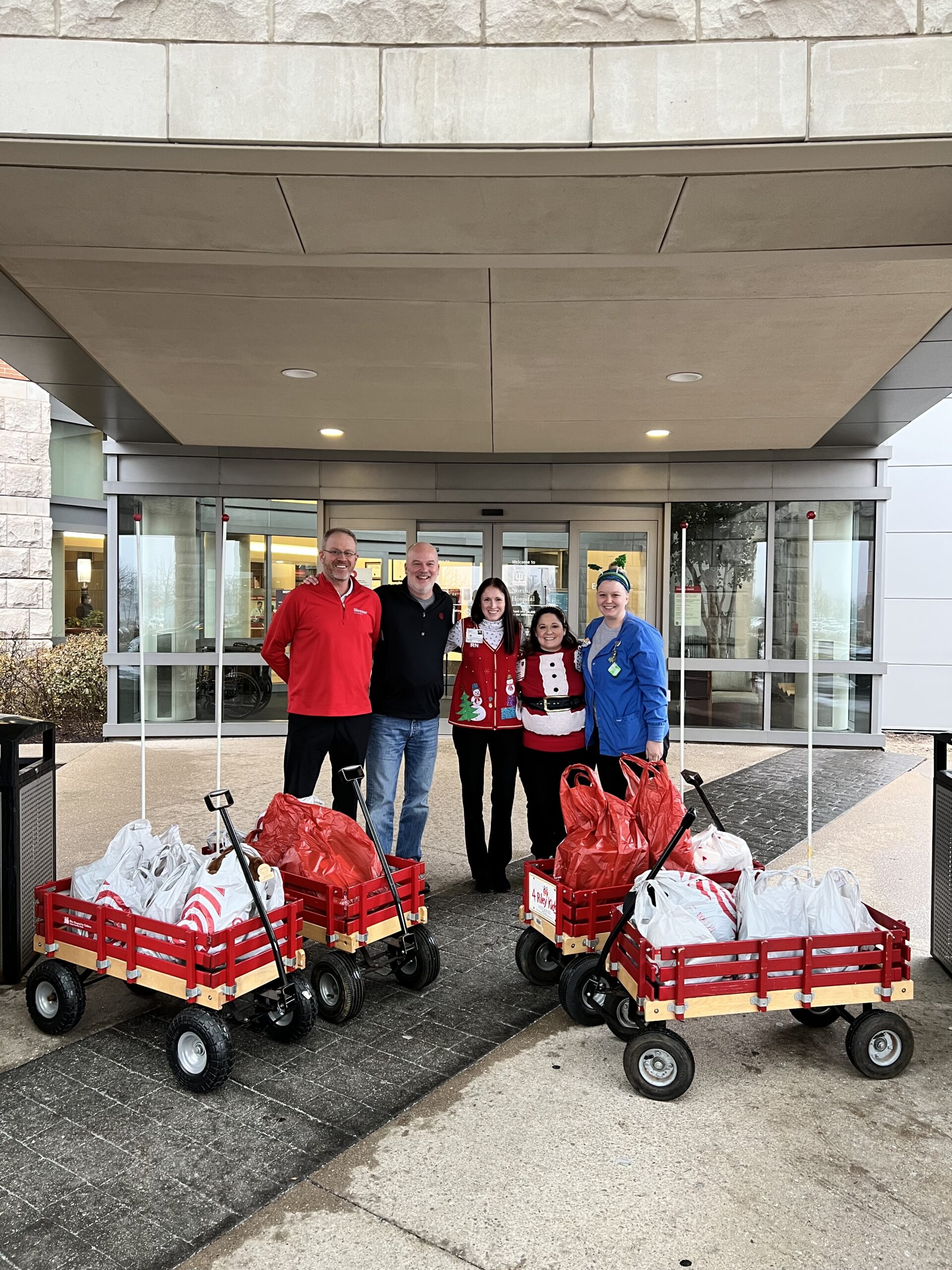 Messer Construction Co employees handing out holiday donations