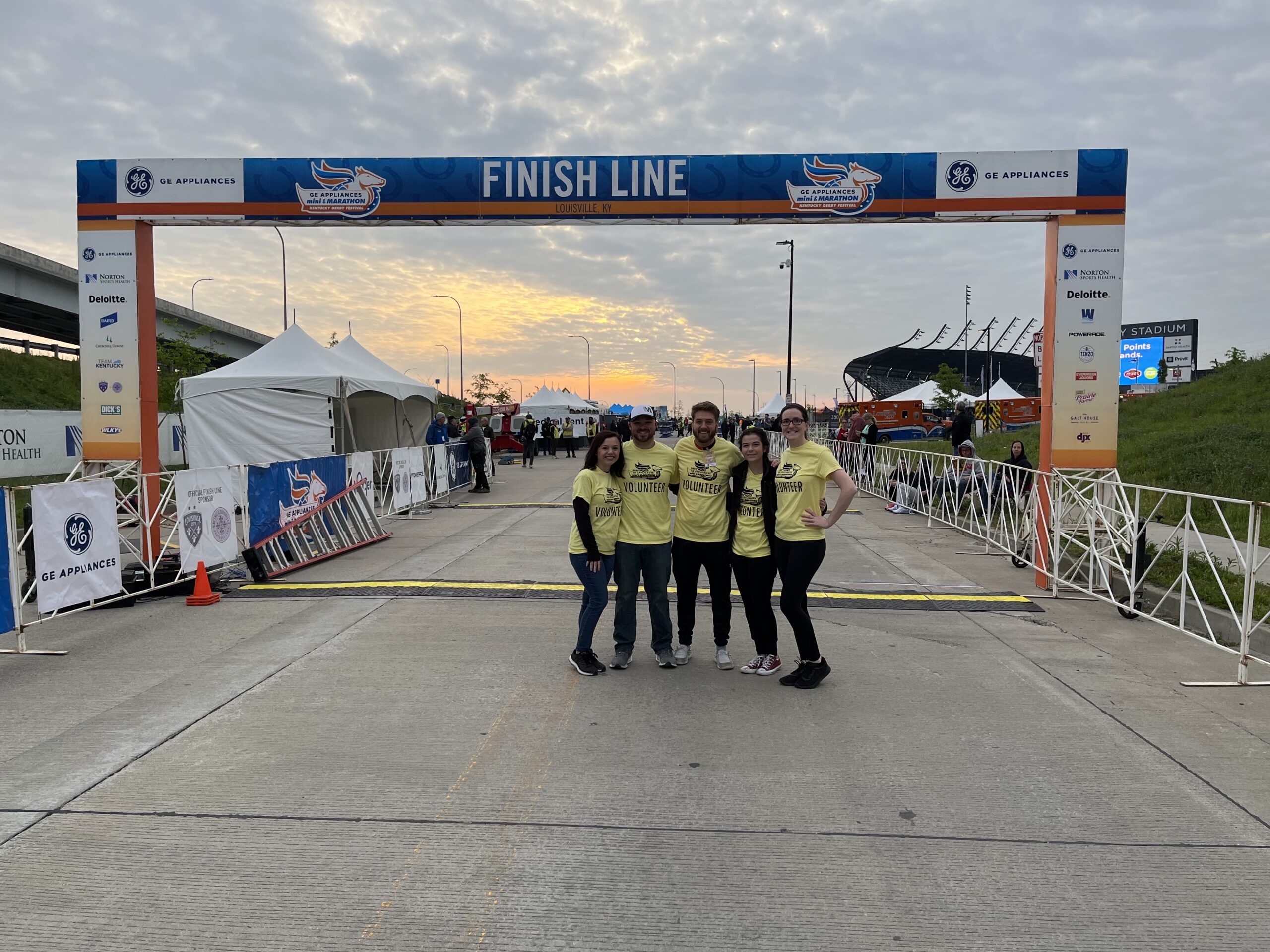 Messer Construction Company employees outside by the finish line at the Kentucky Derby Festival Marathon