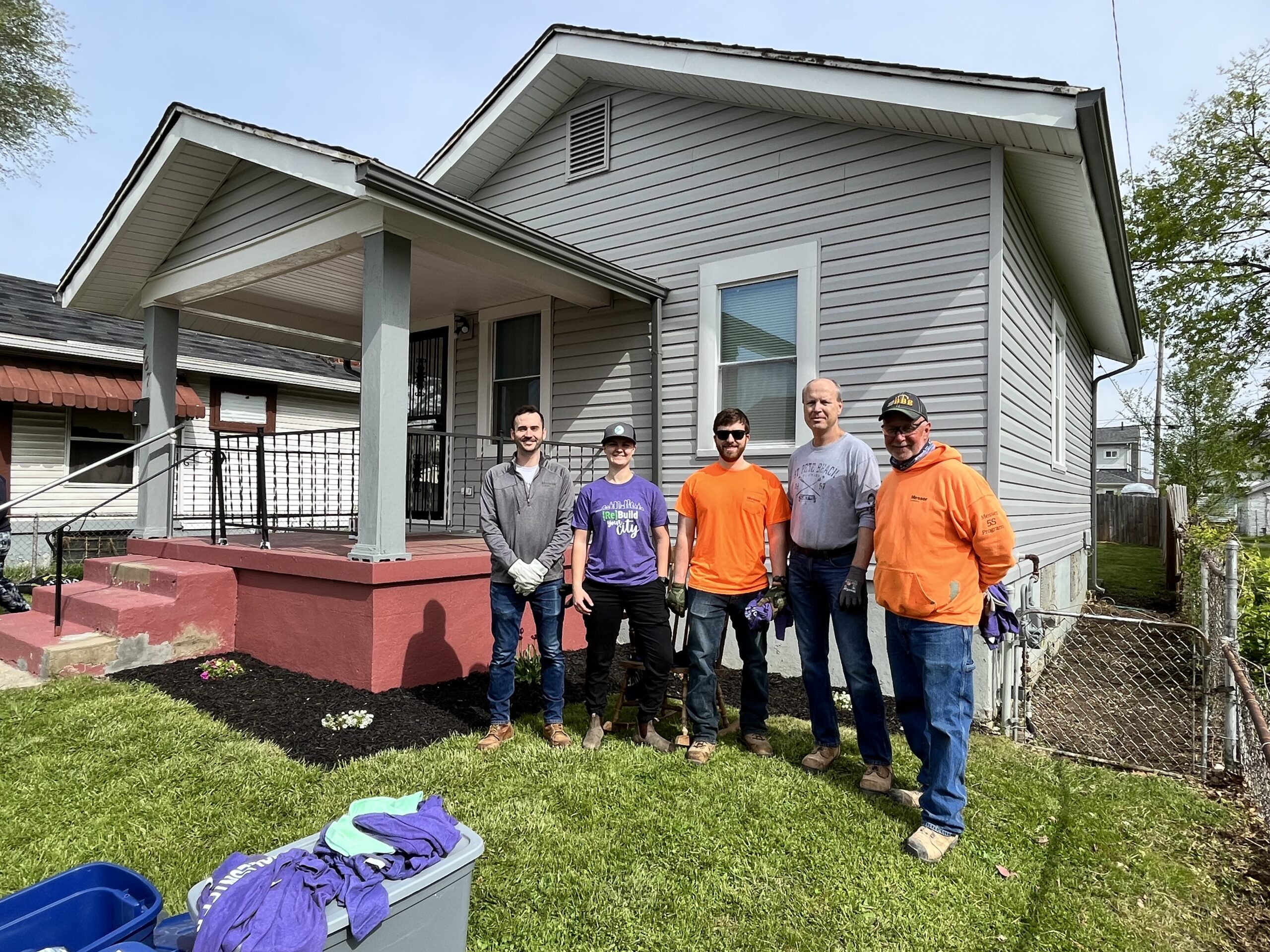 Messer Construction Company employees standing outside at Rebuilding Together volunteer event