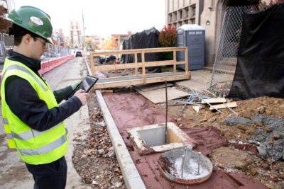 Person holding equipment on a jobsite